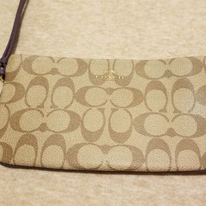 Tan Coach wristlet